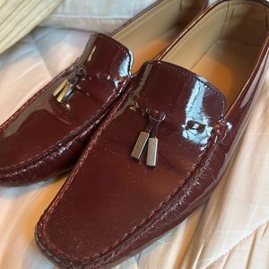 Gently used size 39 ( fit 8.5/9) burgundy, patent leather loafer .